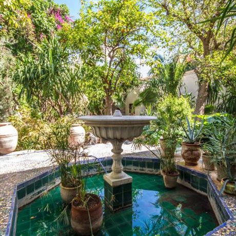 Riad El Arsat Pool Teich Blick auf einen Teich